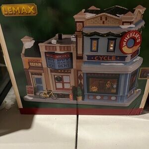 Lemax Wheelie's Cycle Shop with Red and Blue Accents